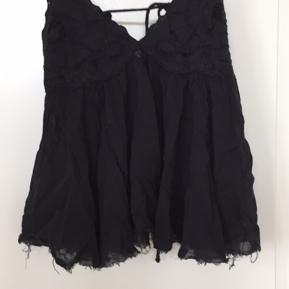Black Free People tank with adjustable strings.